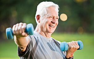 Senior man exercising outdoors in a retirement community